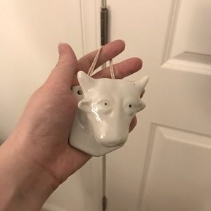 White ceramic cow wall hanging